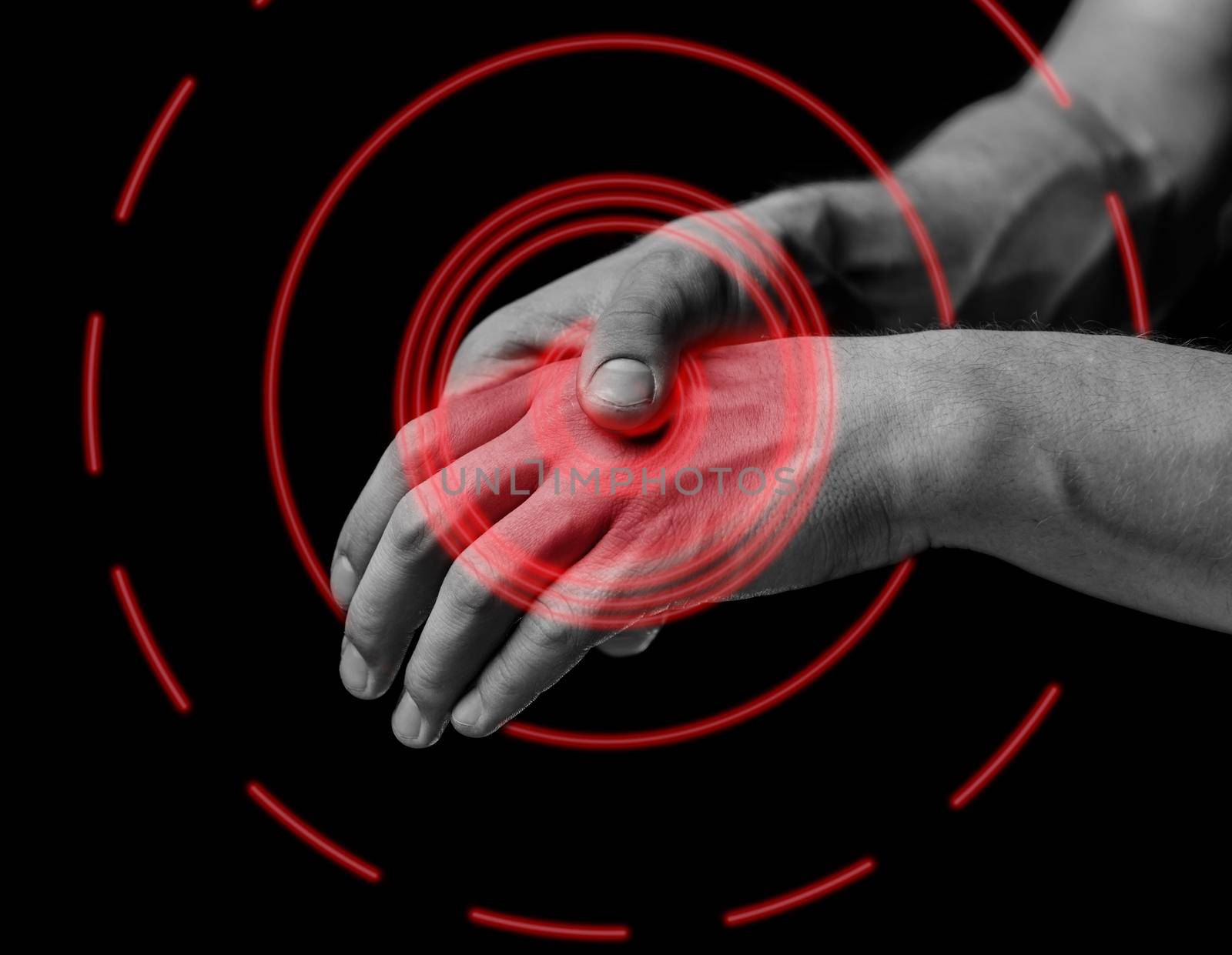 Pain in a male hand. Man holds his hand, black and white image, pain area of red color