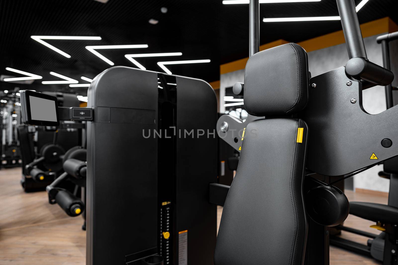 Modern gym interior with new fitness equipment, no people