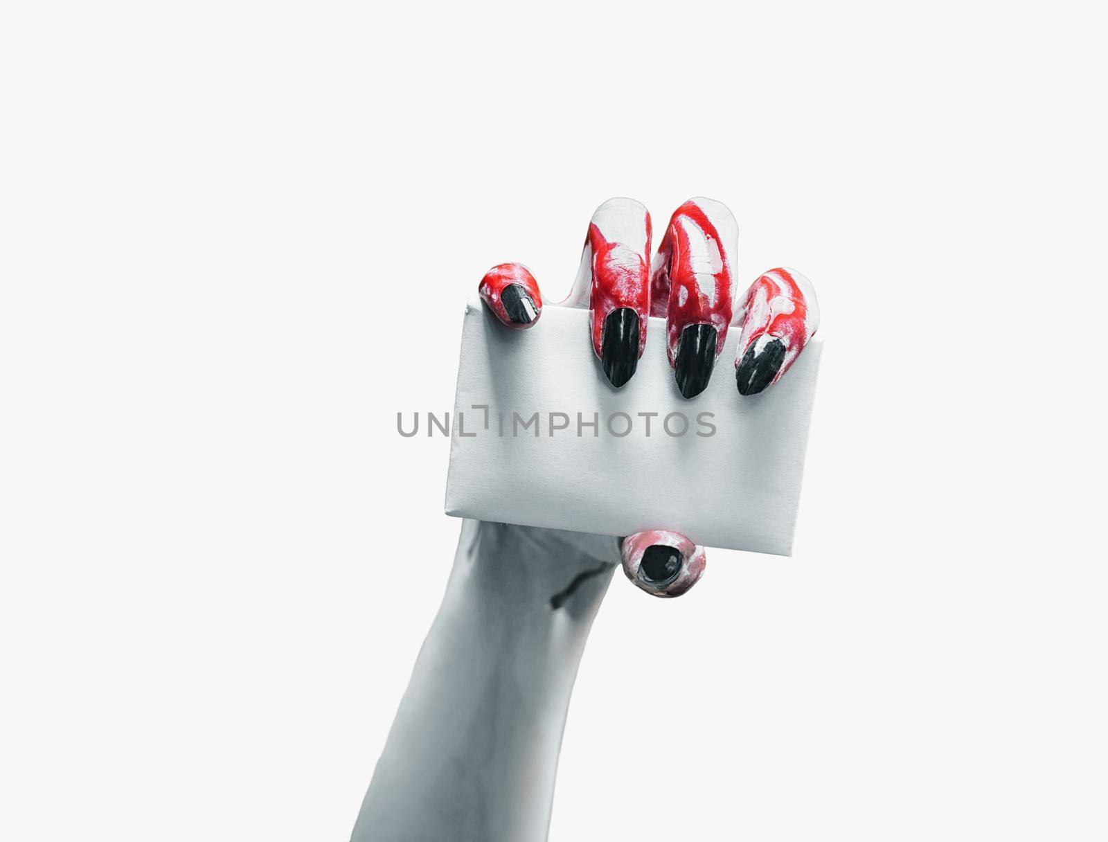Vampire hand holds empty card on white background, space for text. Halloween/horror theme