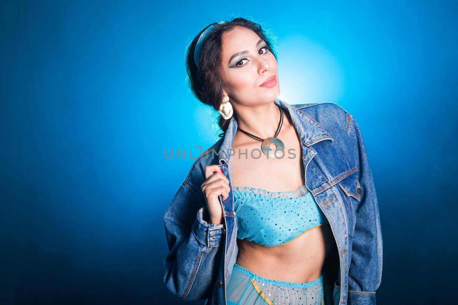 Portrait of young woman in the image of an Eastern fairy Princess in modern clothes.