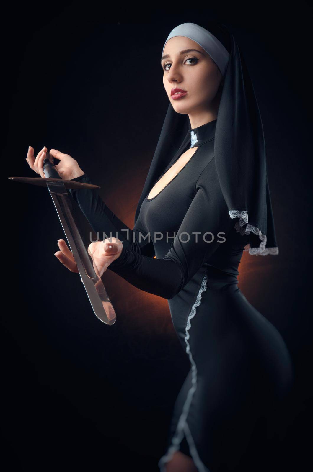 a nun with a weapon in the name of faith by Rotozey