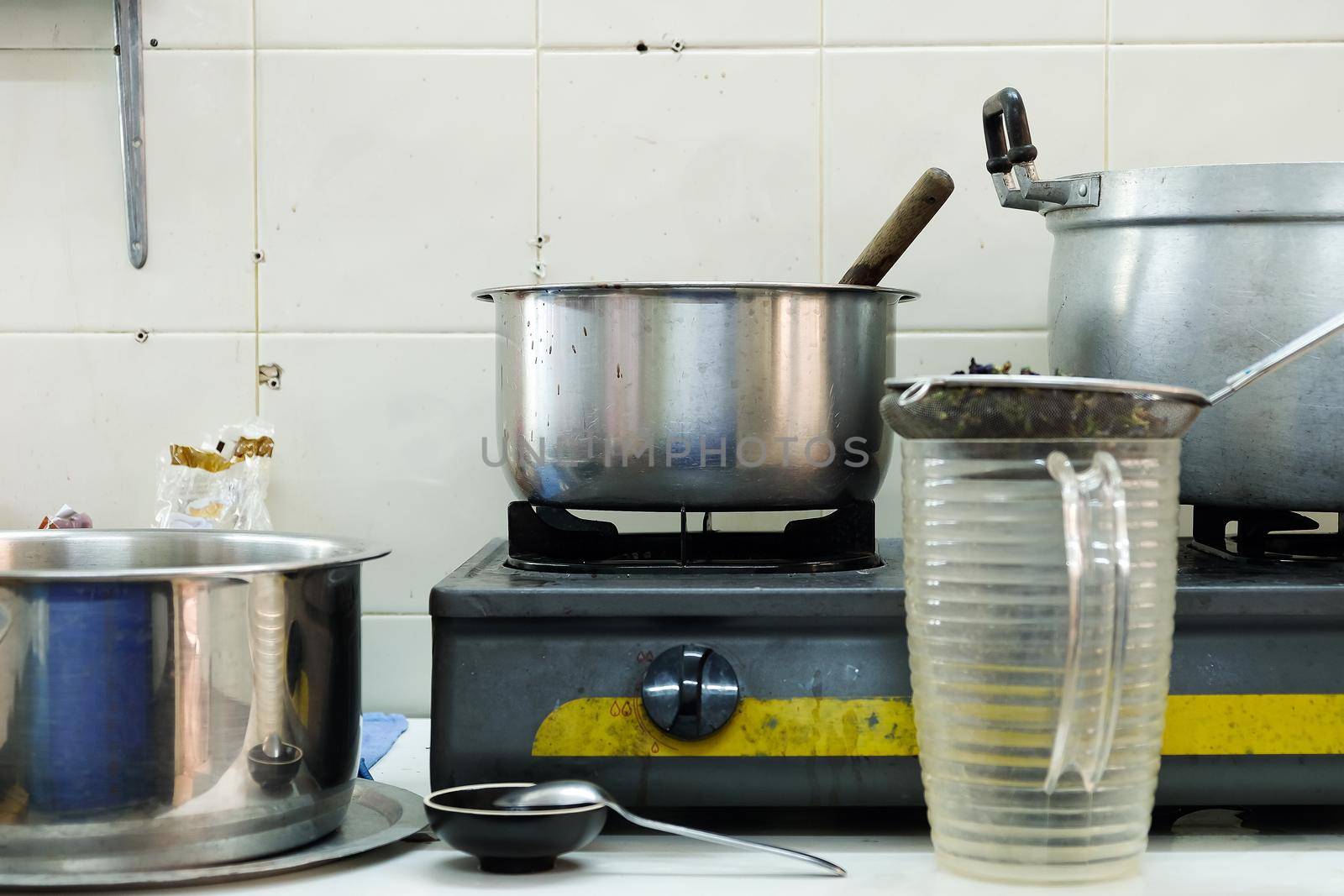 image of Cooking food on kitchen with steel oven, pots