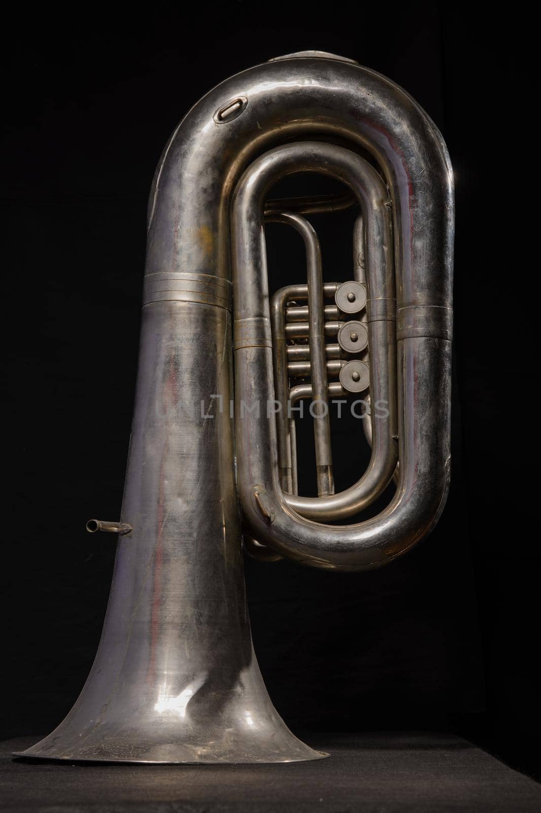 silver tuba isolated on black background