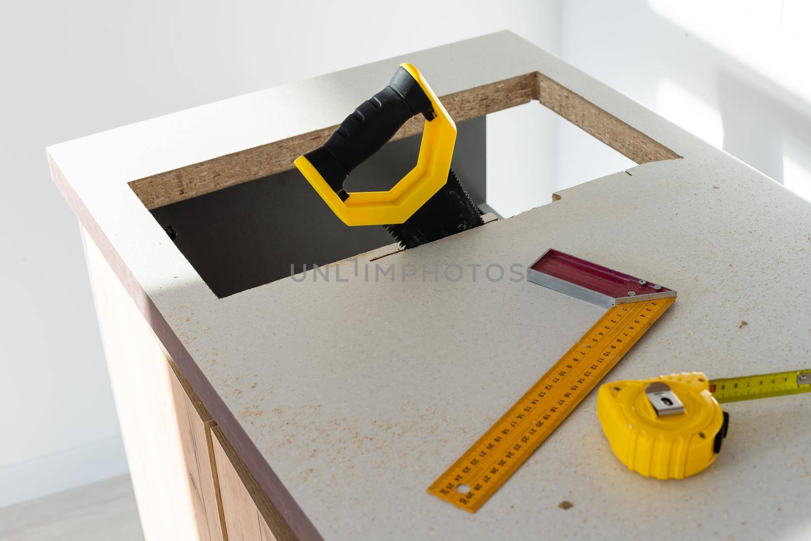 to cut holes in the kitchen countertop for equipment