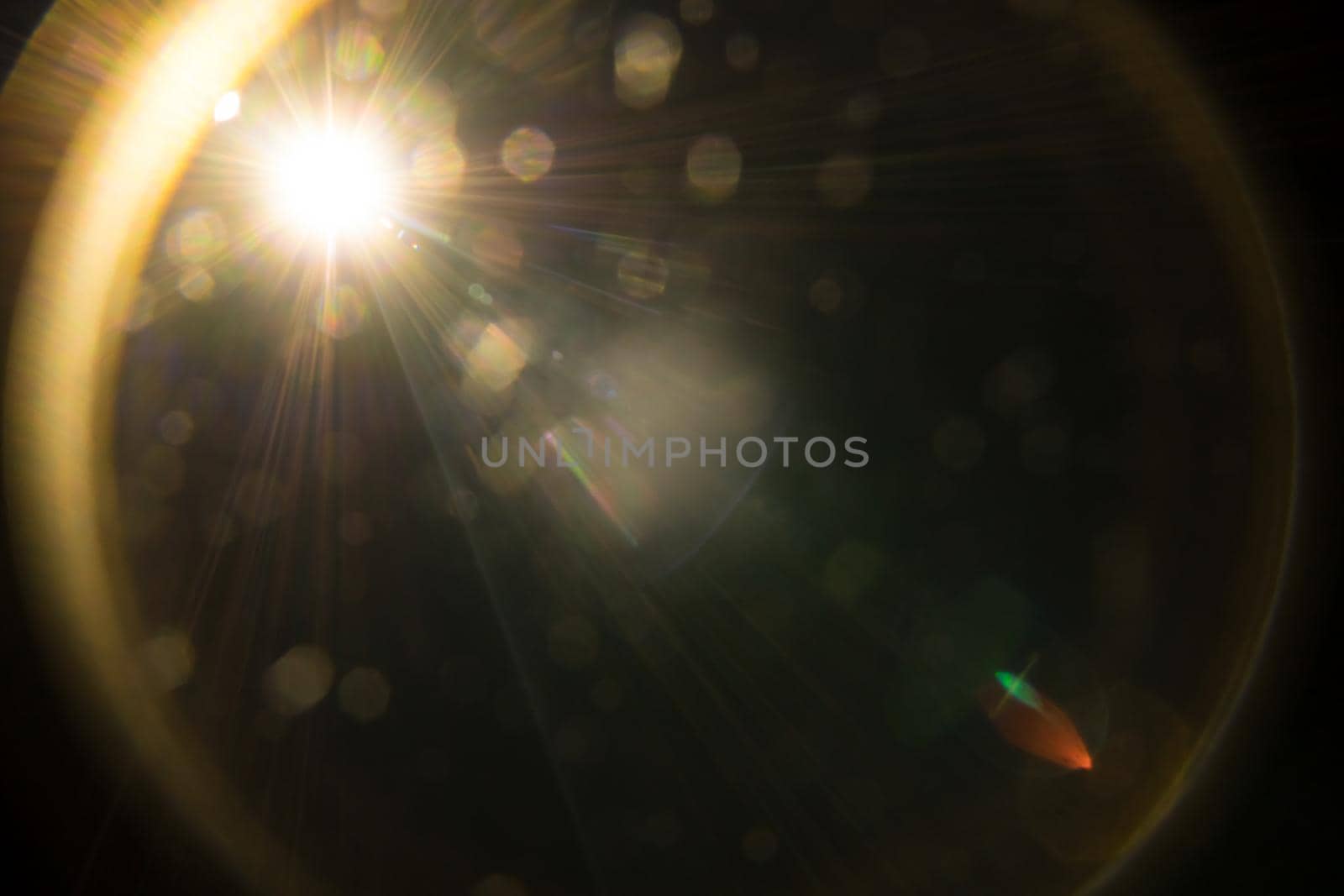 Abstract Natural Sun flare on the black.