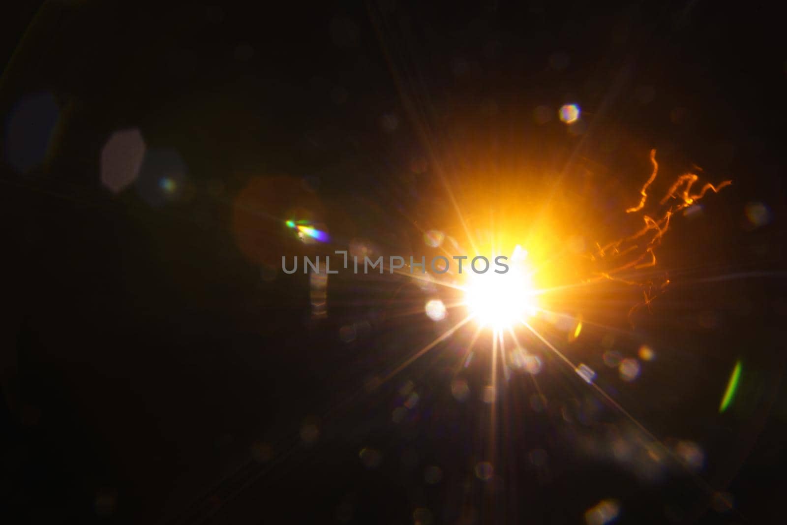Abstract imitation sun starlight distant galaxy on a black background. -image