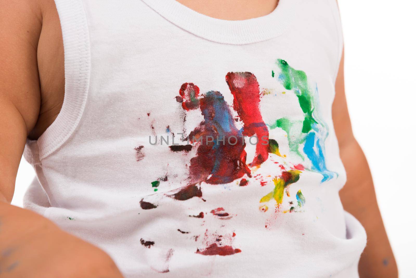 white shirt of a kid painted with colors