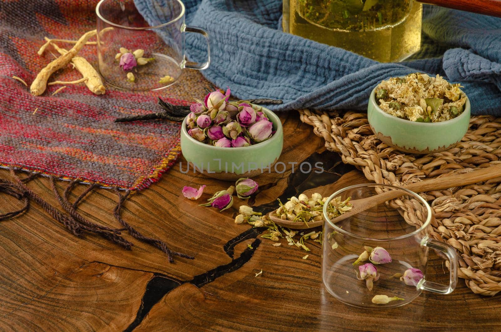 table with herbal tea and rose petals