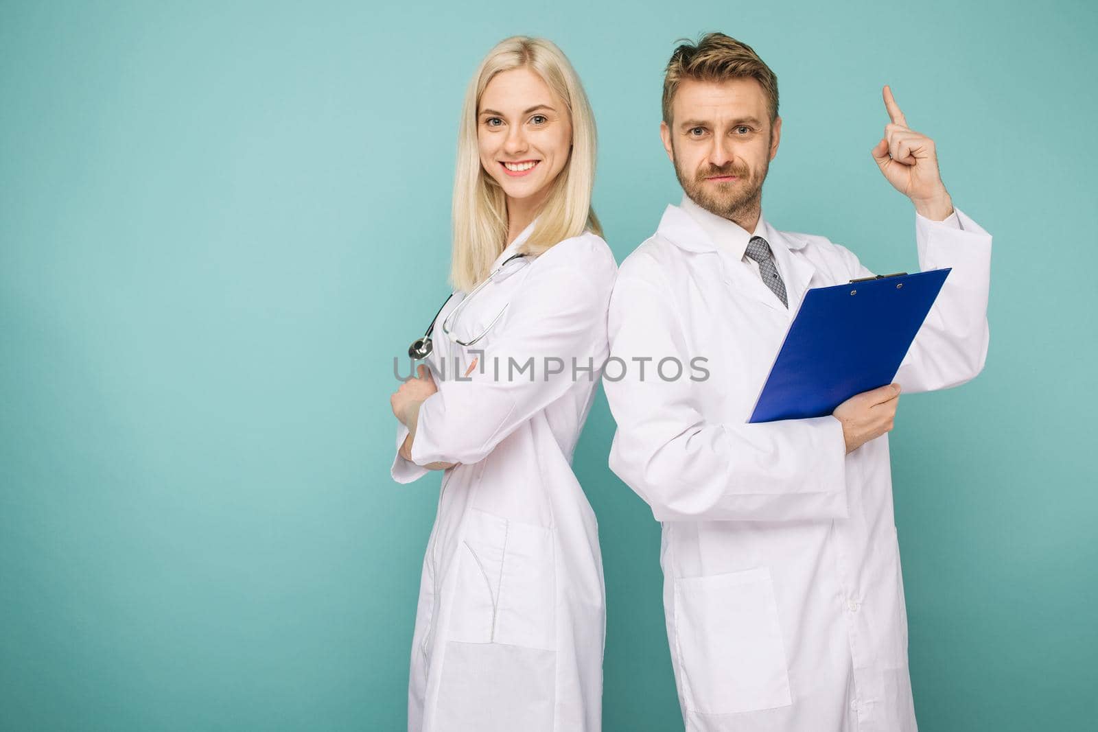 Friendly Male and Female Doctors. Happy medical team of doctors. by zartarn