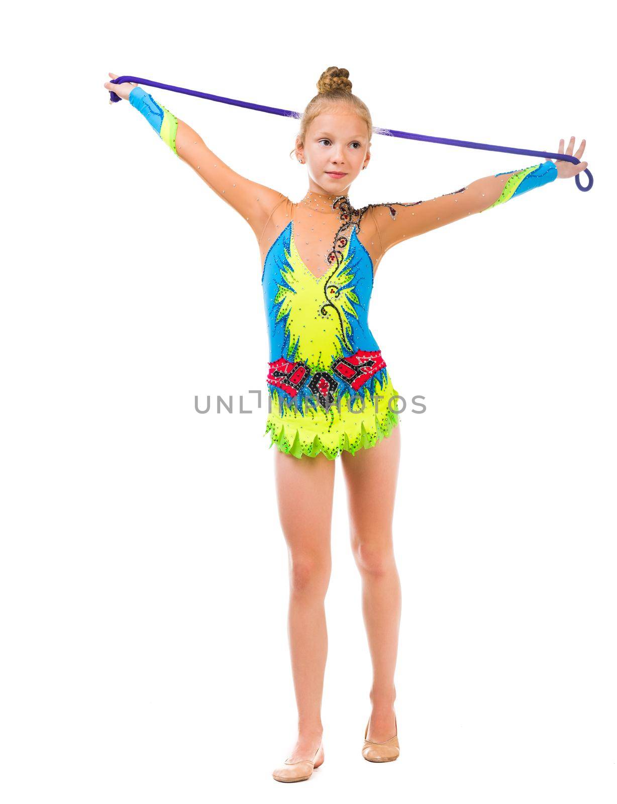 little gymnast holding a skipping rope over her head isolated on white background