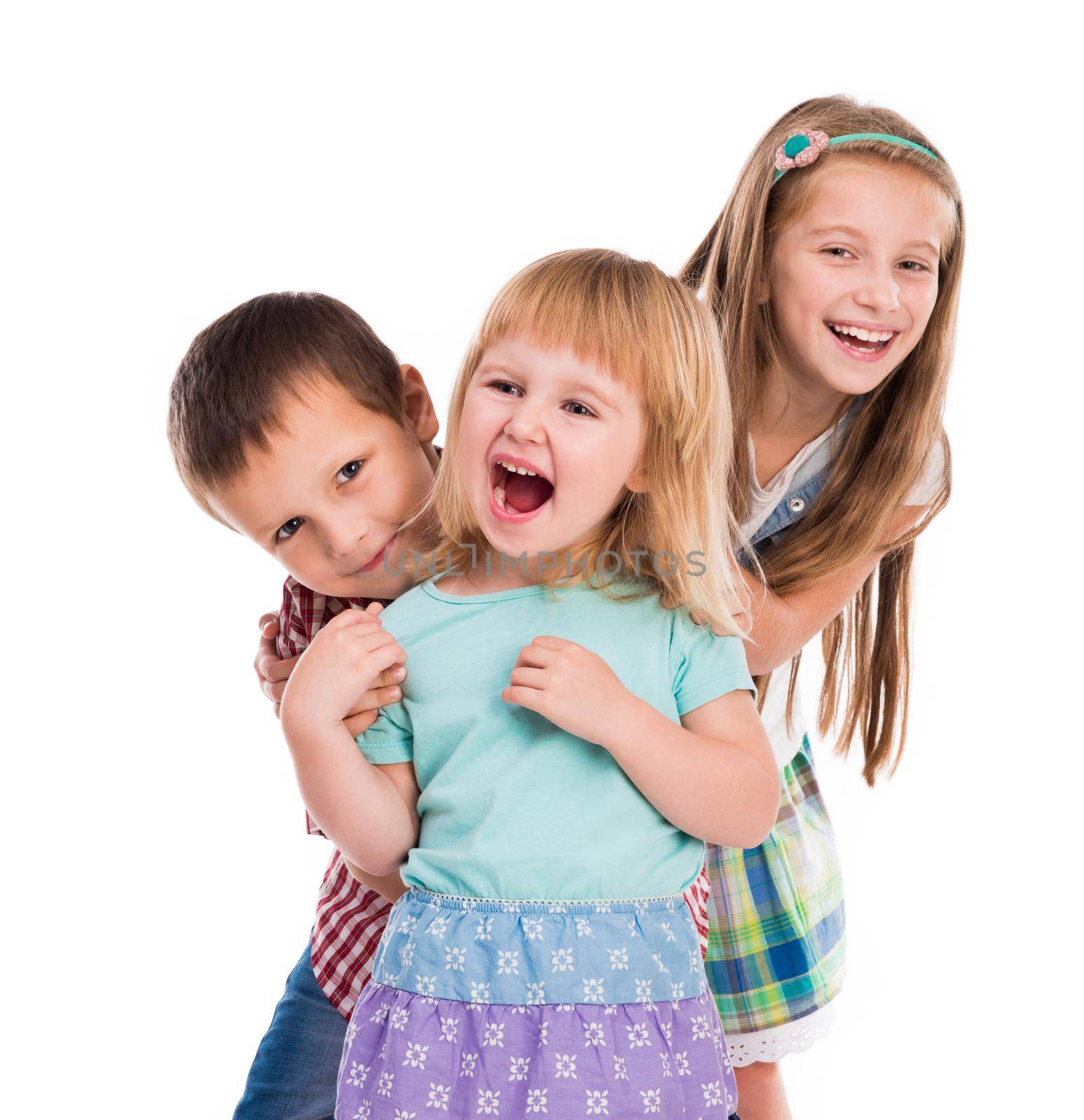 three cute children smiling isolated on white background