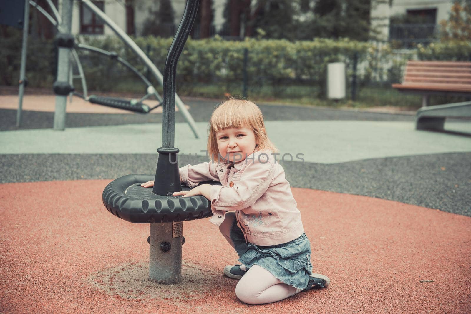 joyful little girl on a playground