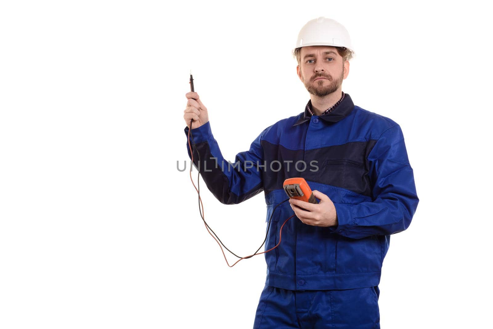 electrician engineer in helmet and uniform with tester instrument in hands isolated on white background