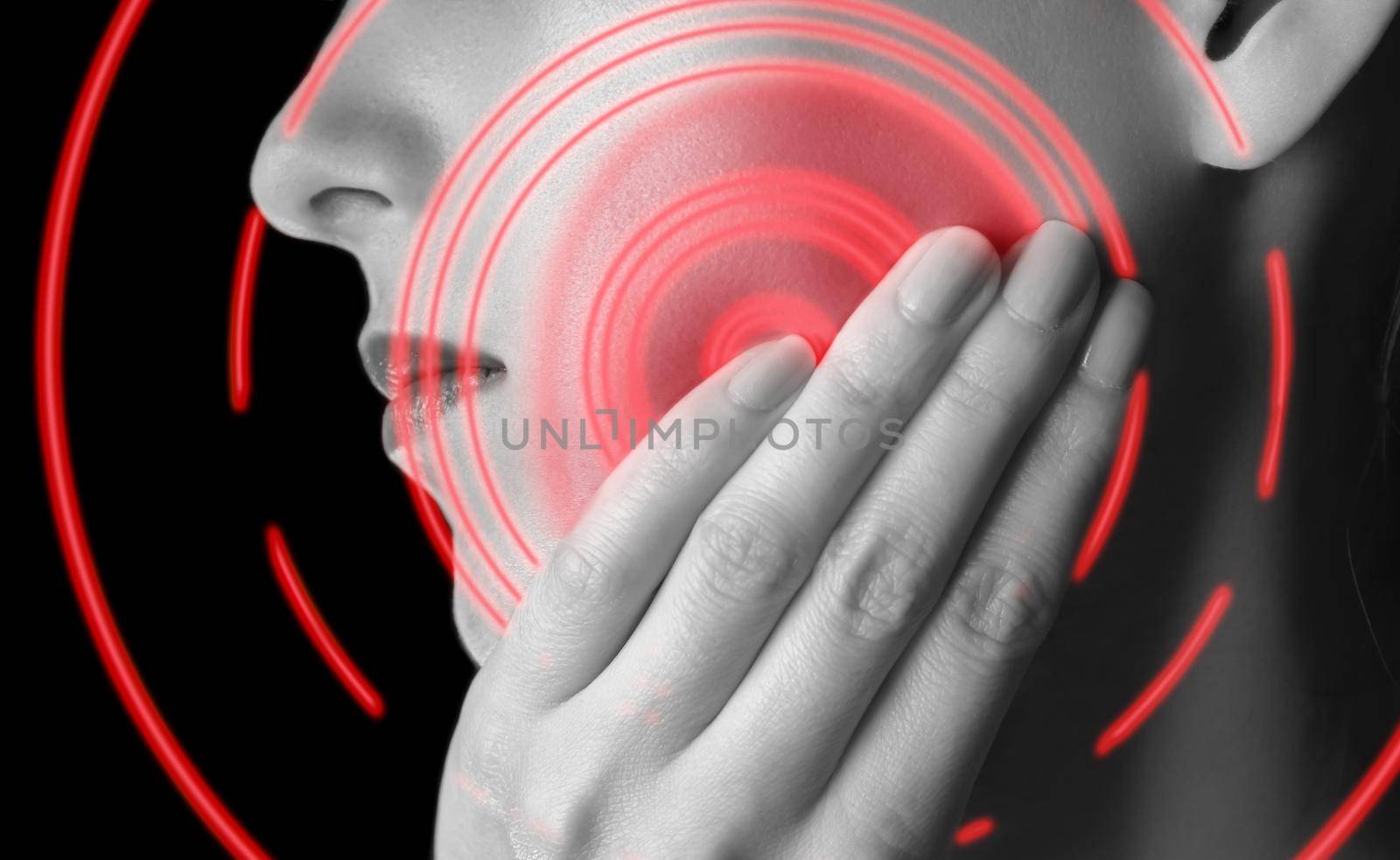 Woman is touching her cheek, toothache, black and white image, pain area of red color