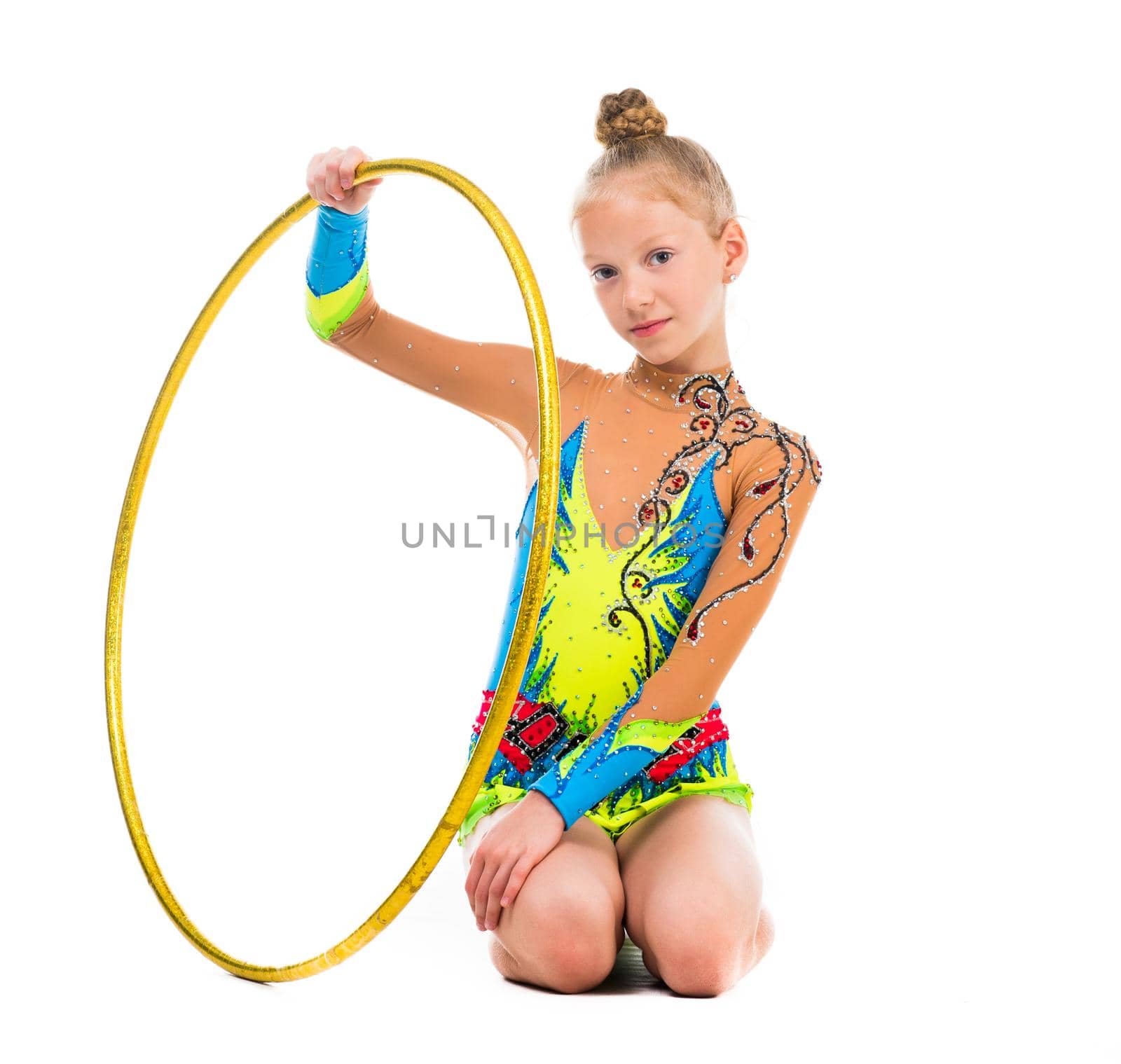 little gymnast sitting on the floor with hoop isolaten on white background