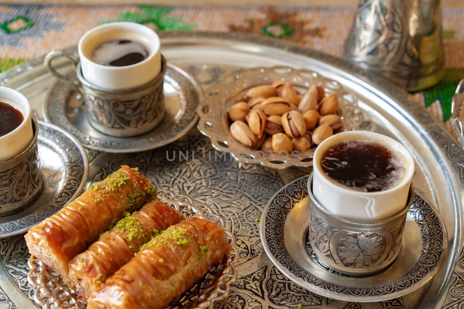 Traditional arabic dessert baklava with a cup of turkish coffee, close up