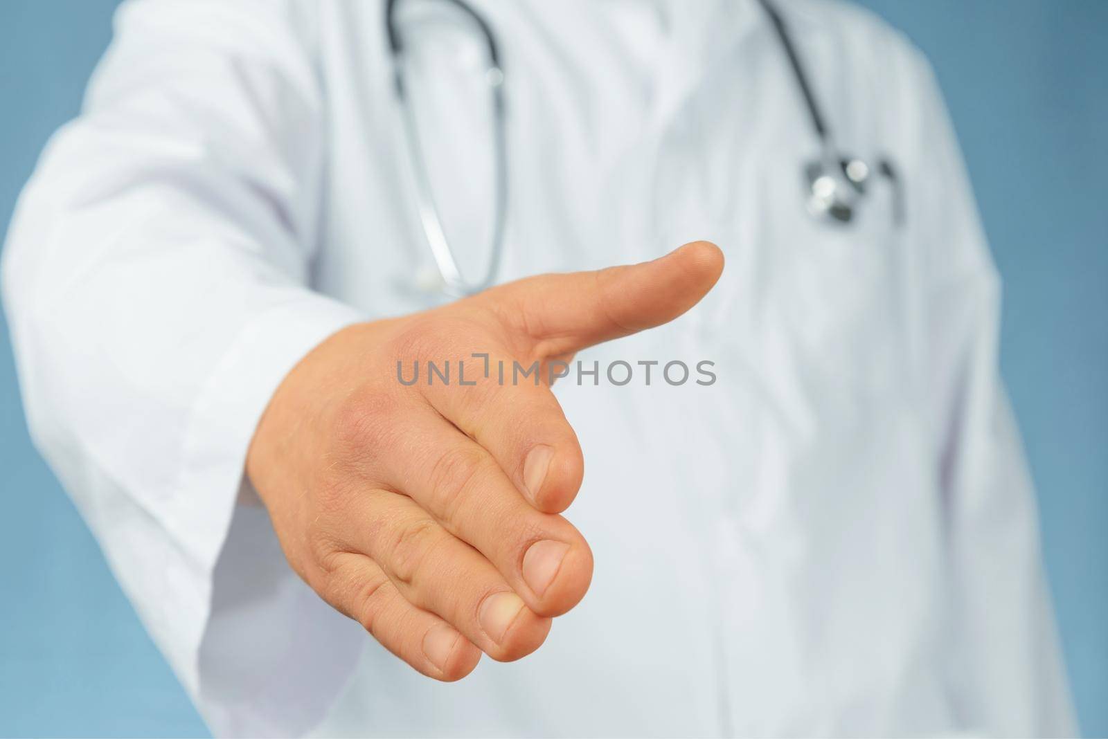 Unrecognizable man doctor gives his hand for handshake