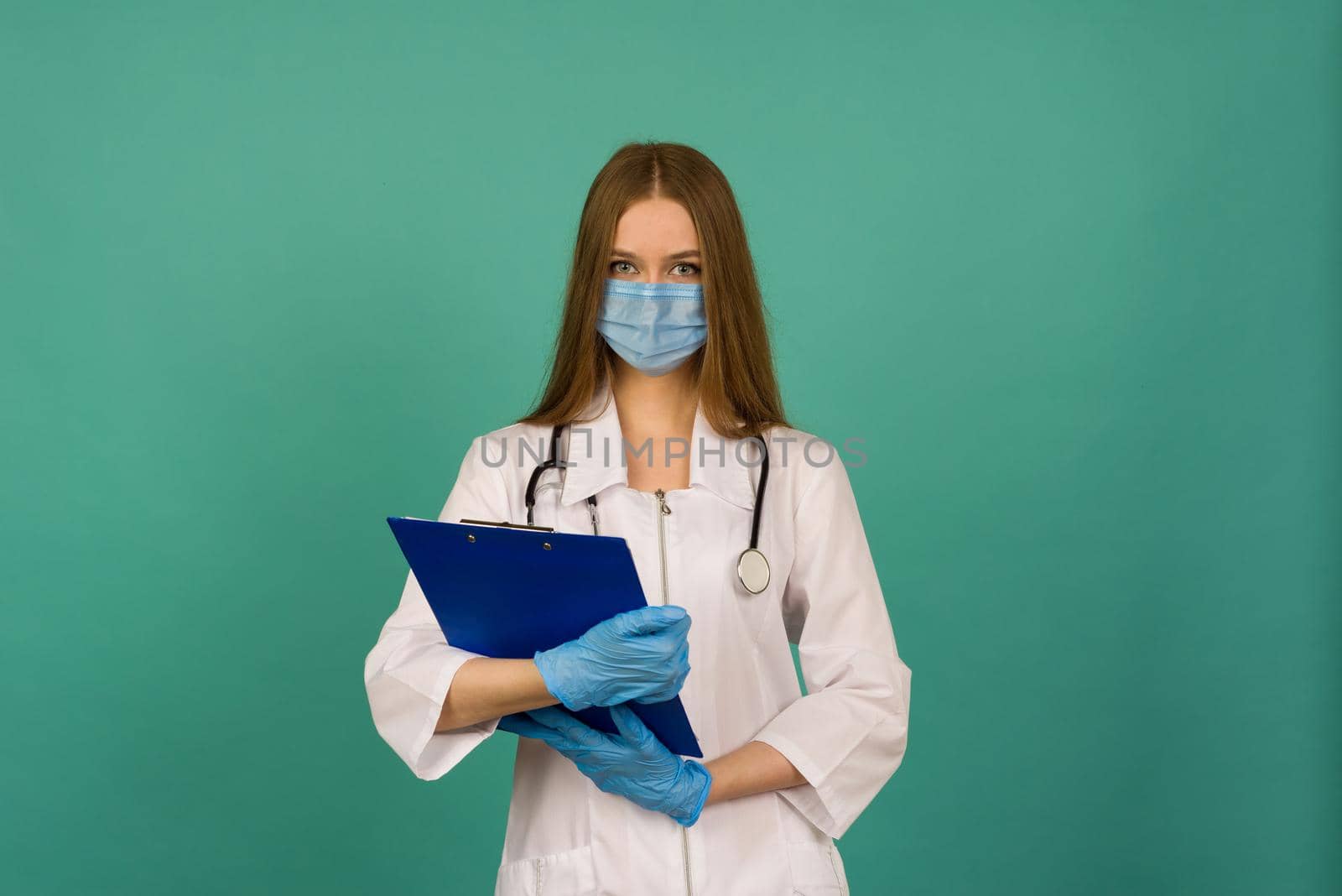 Covid19, coronavirus, healthcare. Portrait of professional confident young caucasian doctor in medical mask and white coat, stethoscope over neck, ready help patient, fight disease - image