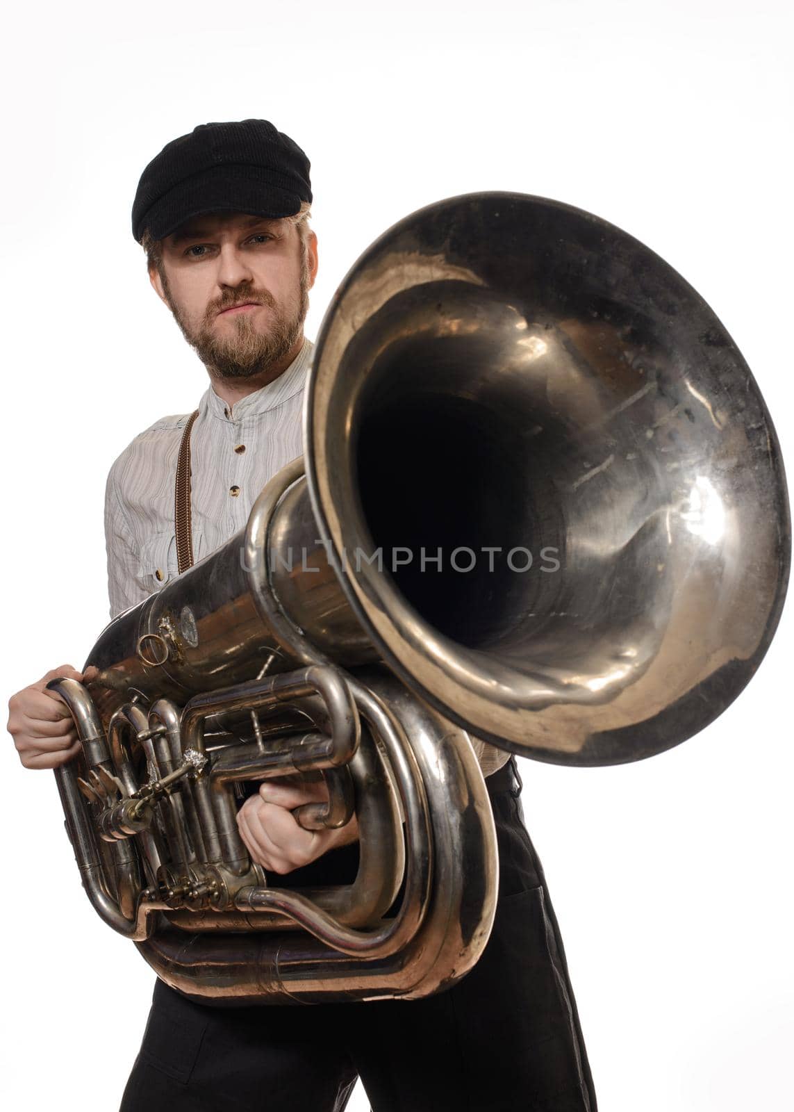 beard man with suspenders and cap holding the tube