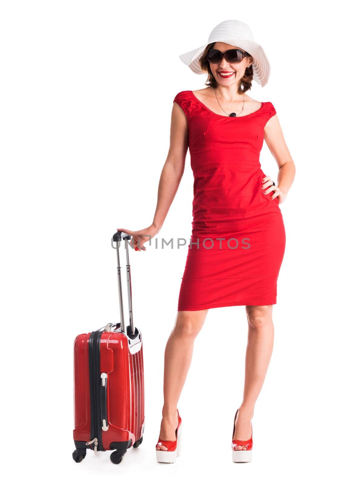 beautiful girl with red suitcase and hat going on vacation