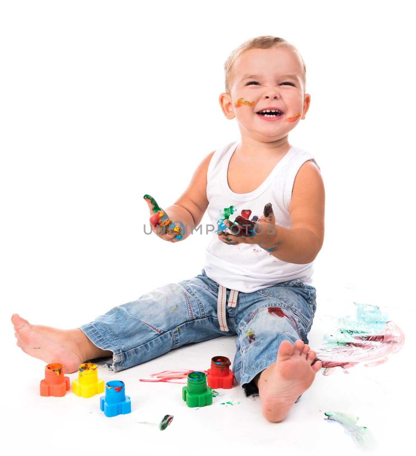 joyful little boy with paints isolated on white background