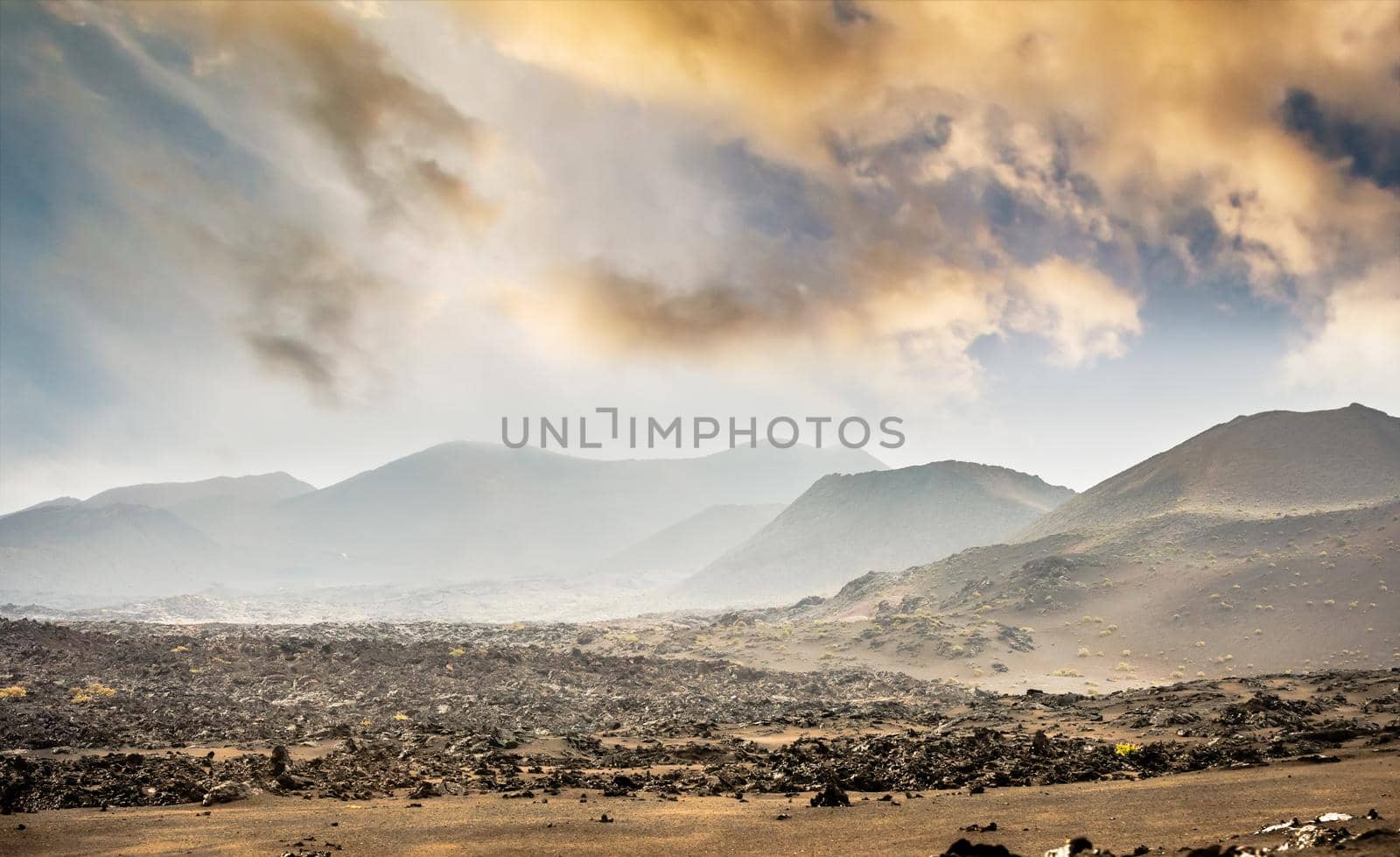beautiful mountain landscape with volcanoes in Timanfaya National Park at sunset in Lanzarote, Canary Islands
