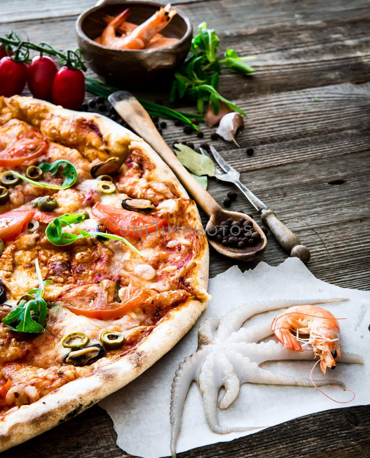 delicious pizza with seafood on wooden table