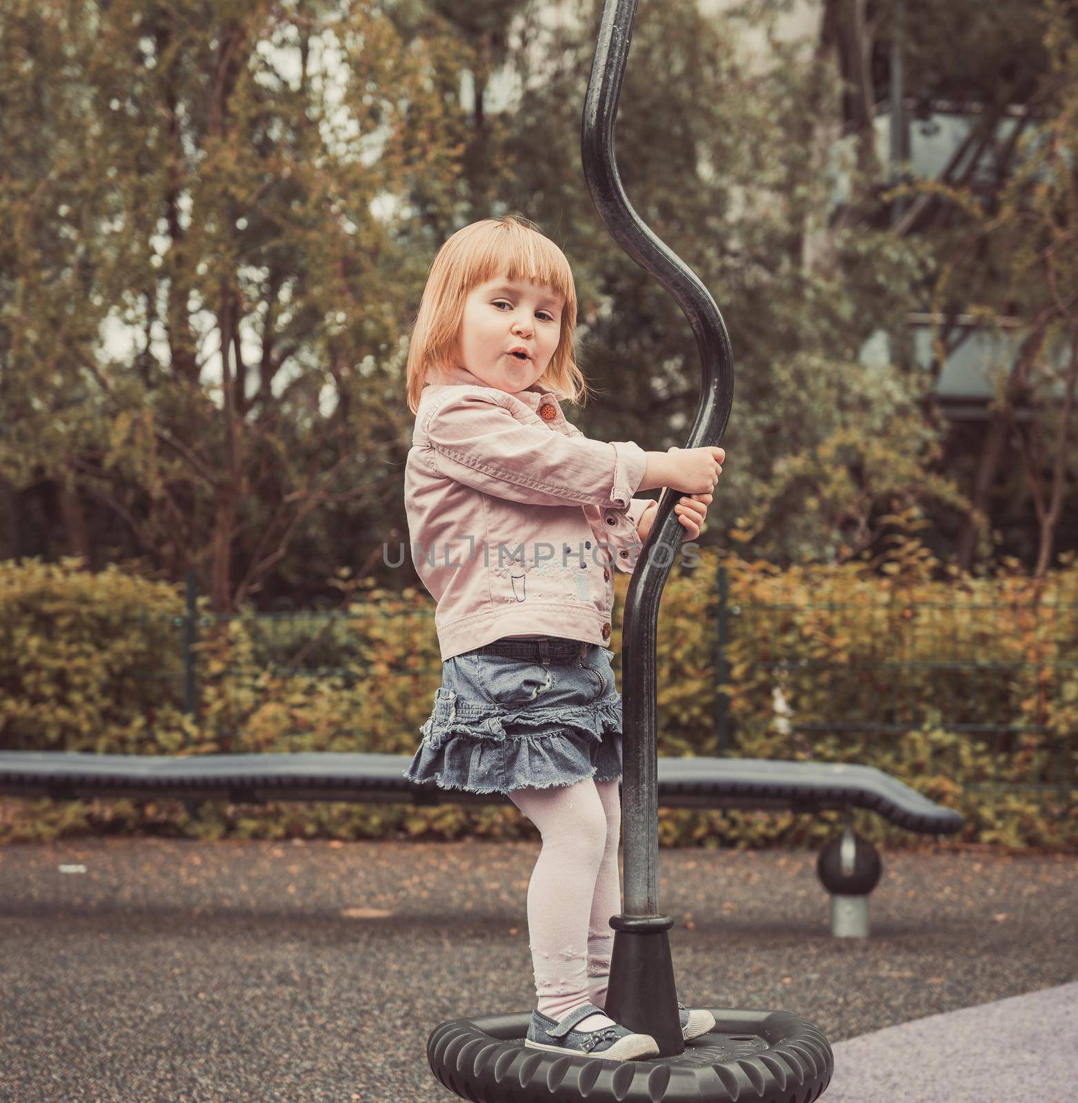 playing little girl on a playground