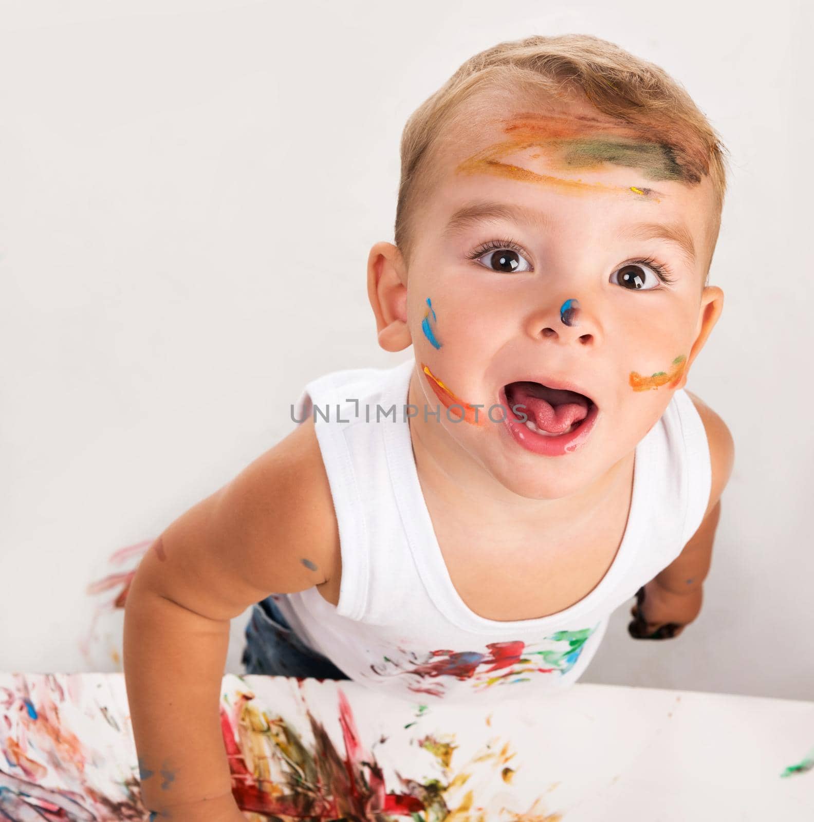 cheerful little boy with painted face portrait