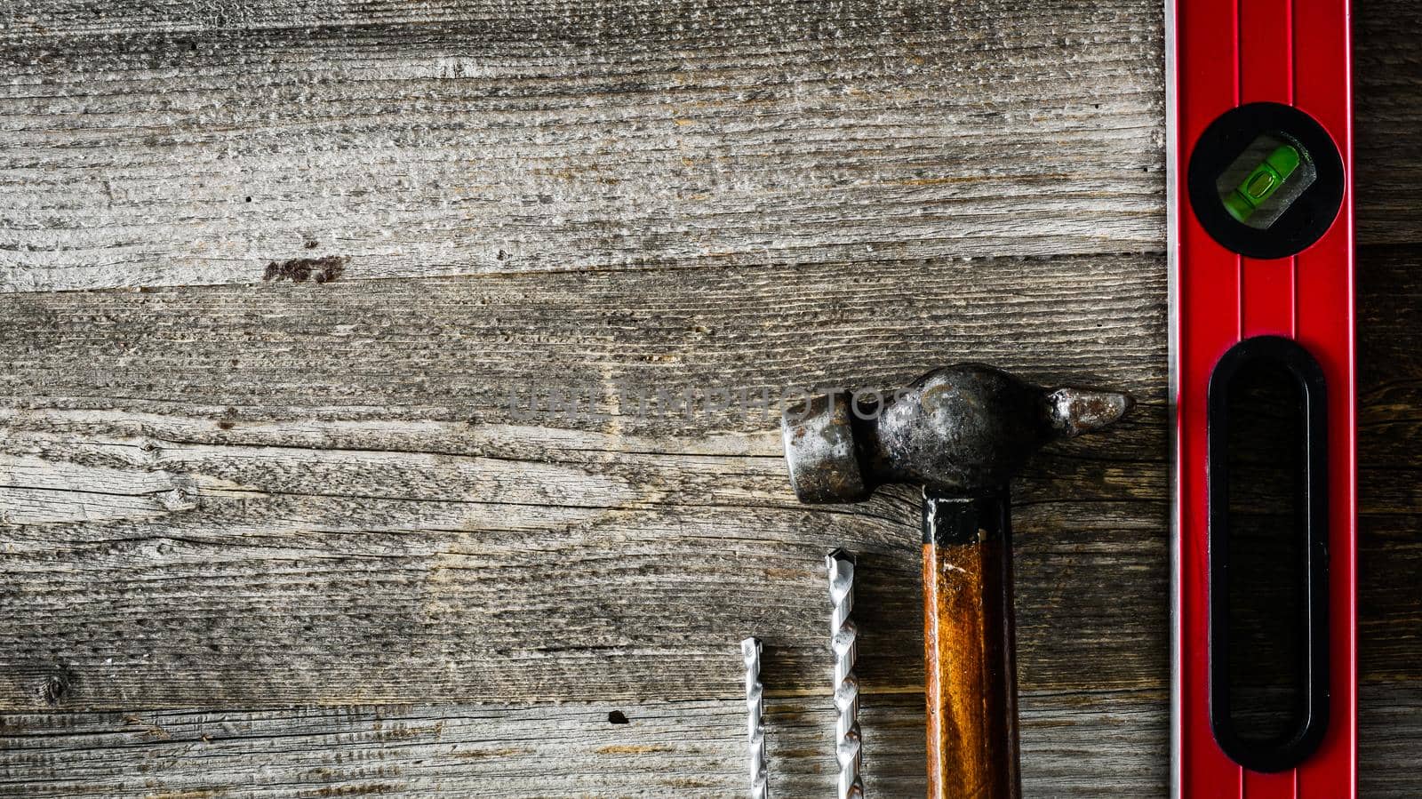 building tools on wooden table on side