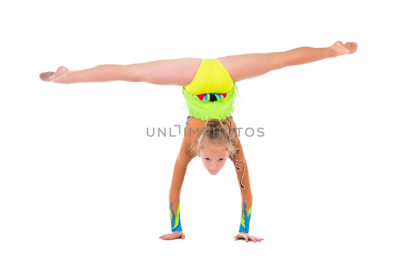 little gymnast standing on hands isolated on white background