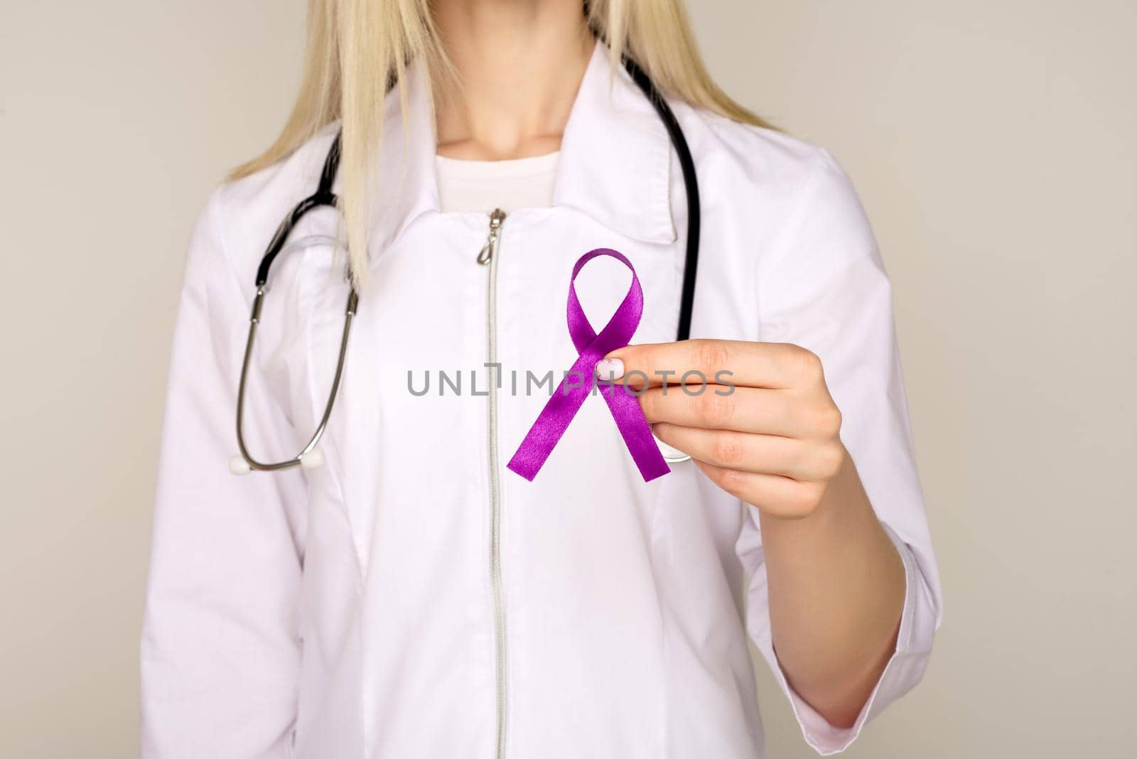 Female doctor in white uniform with purple awareness of ribbon in hand for ADD,ADHD,Alzheimer Disease ,Arnold Chiari Malformation,Childhood Hemiplegia stroke, Epilepsy, Chronic Acute Pain,Crohns - Image