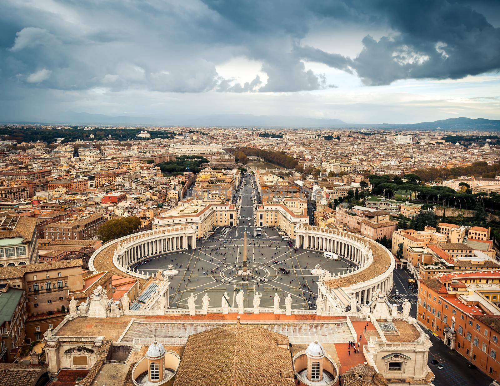 Famous Saint Peter's Square in Vatican and aerial view of the city, Rome, Italy.