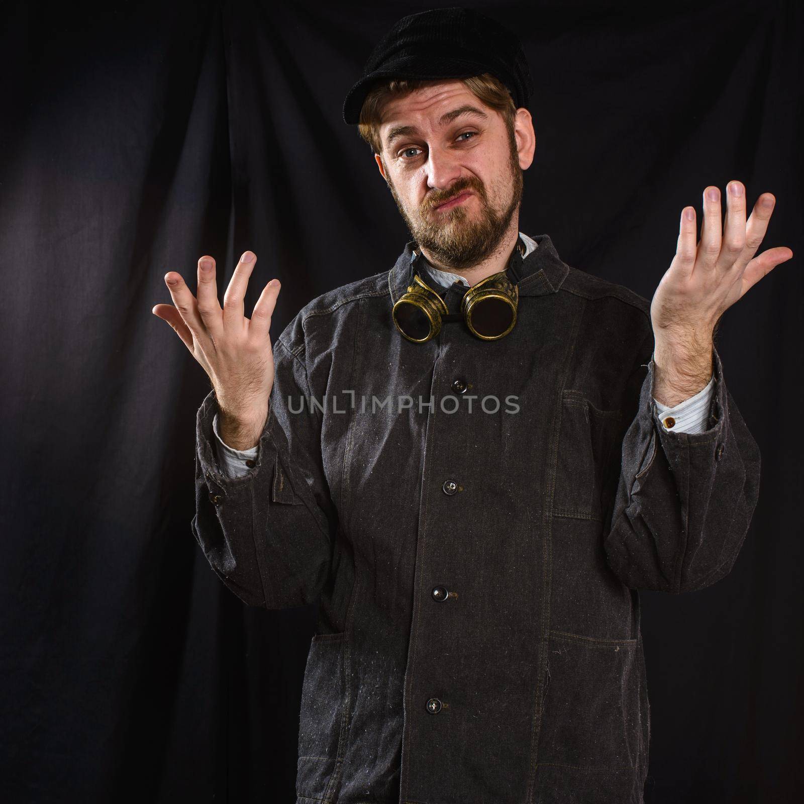 dissatisfied welder in black boilersuit