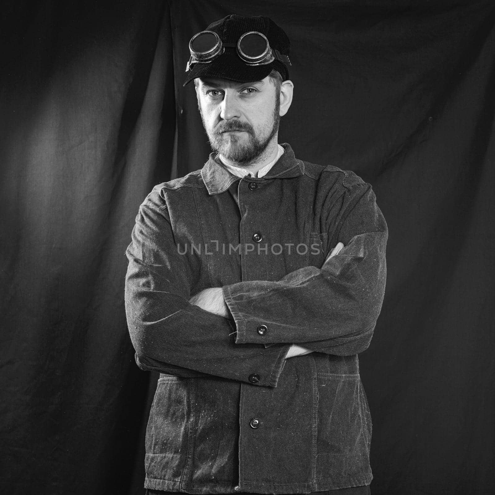 beard welder with arms crossed on his chest