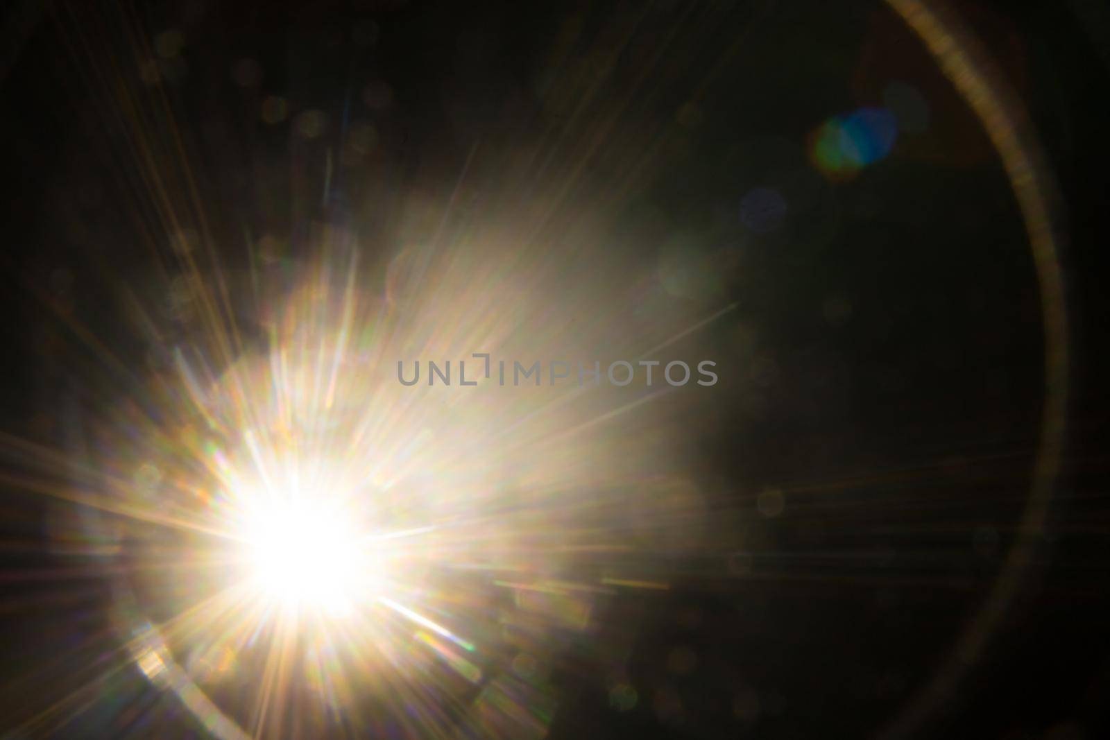 Abstract Natural Sun flare on the black.