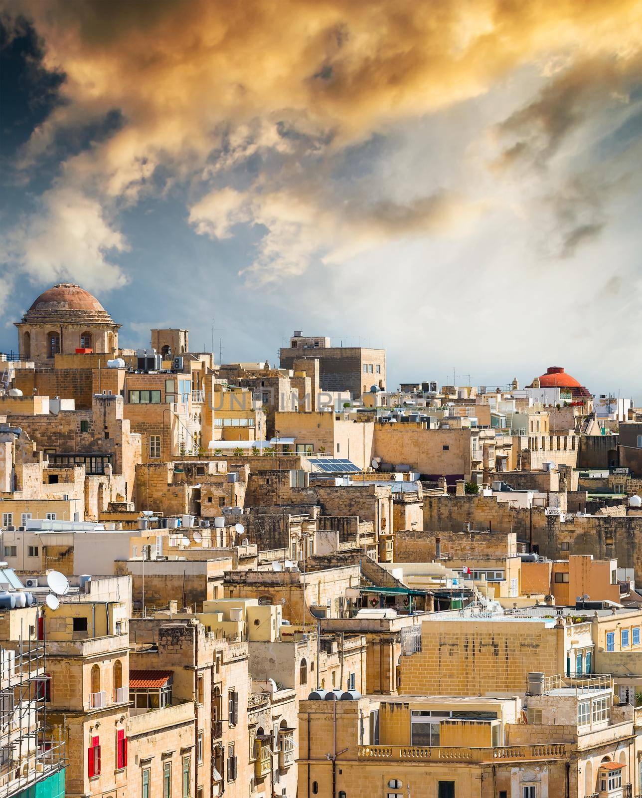 beautiful view on houses and roofs of Valletta in Malta in sunset