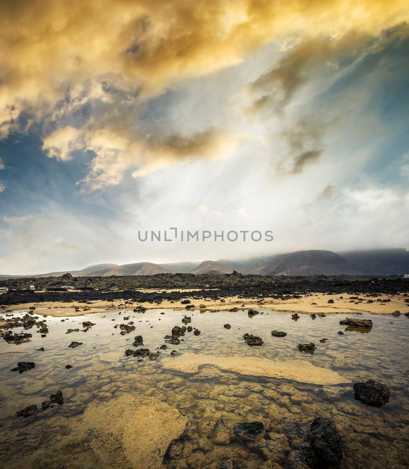beautiful desert mountain landscape with water on the island of Lanzarote, Canary Islands