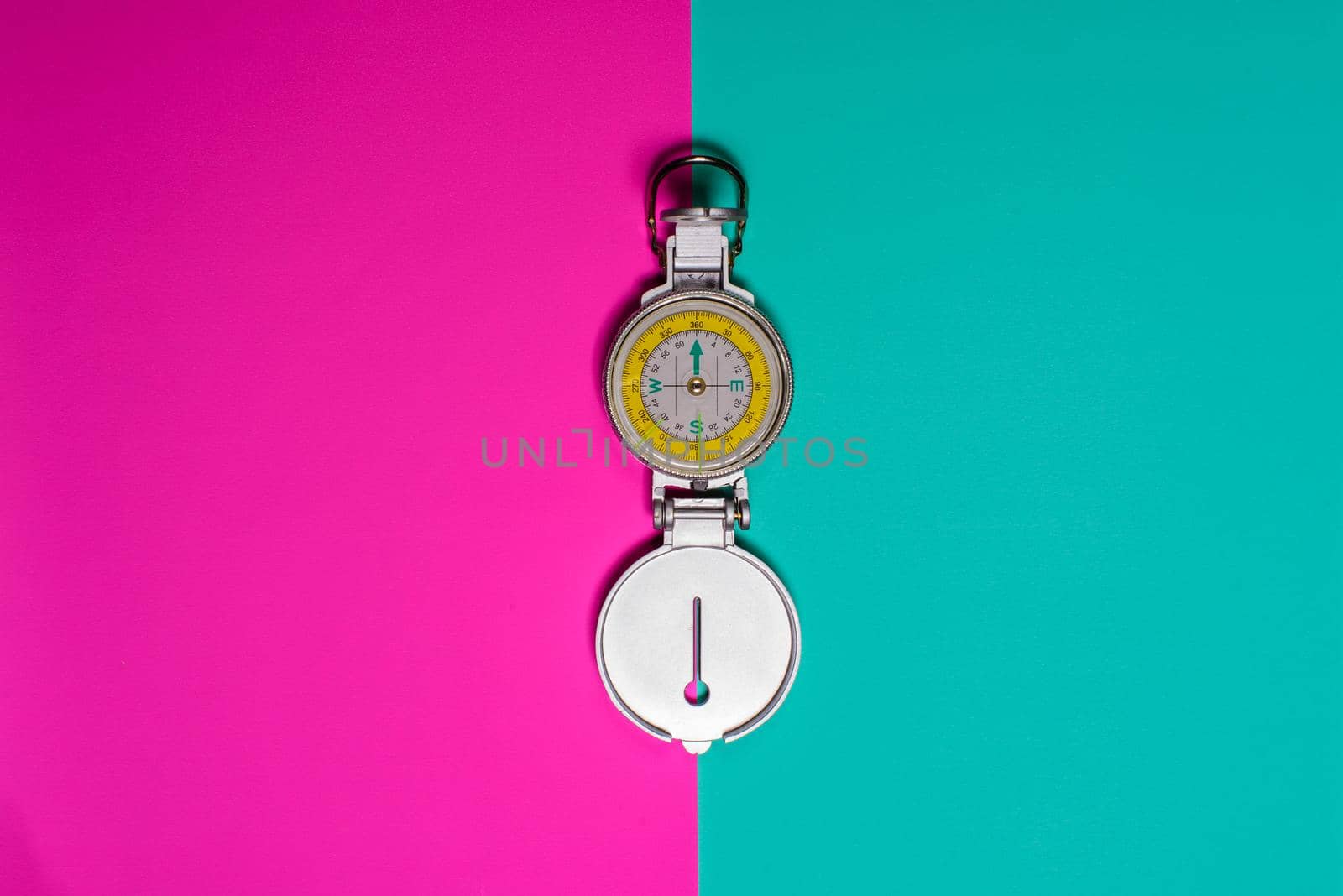 compass on colored background studio