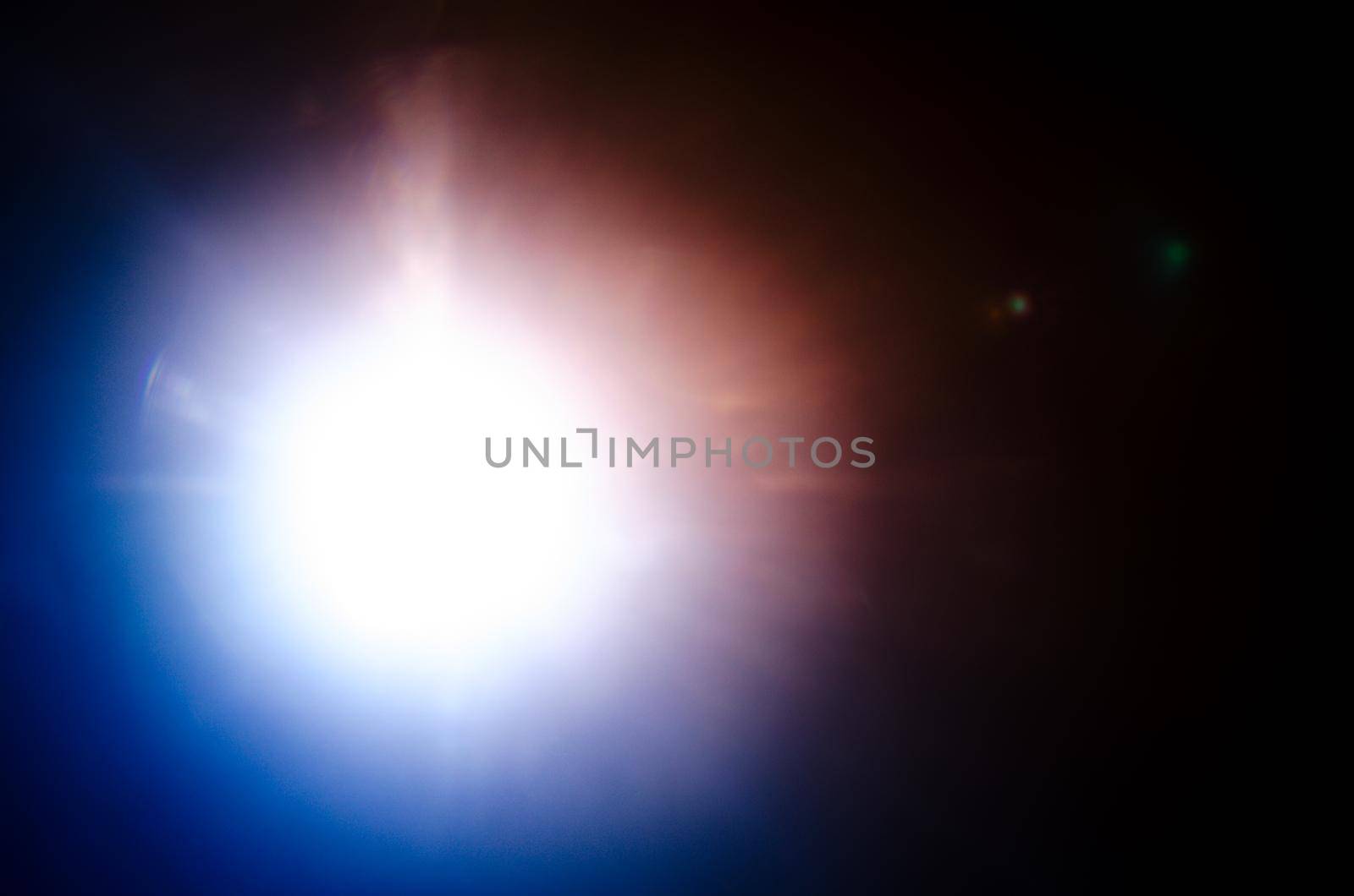 Abstract Natural Sun flare or Far star on the black background - image
