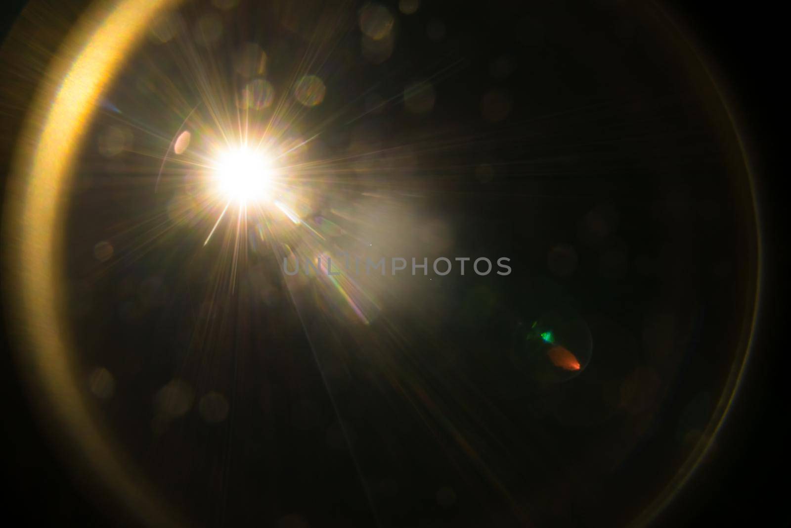Abstract Natural Sun flare on the black.