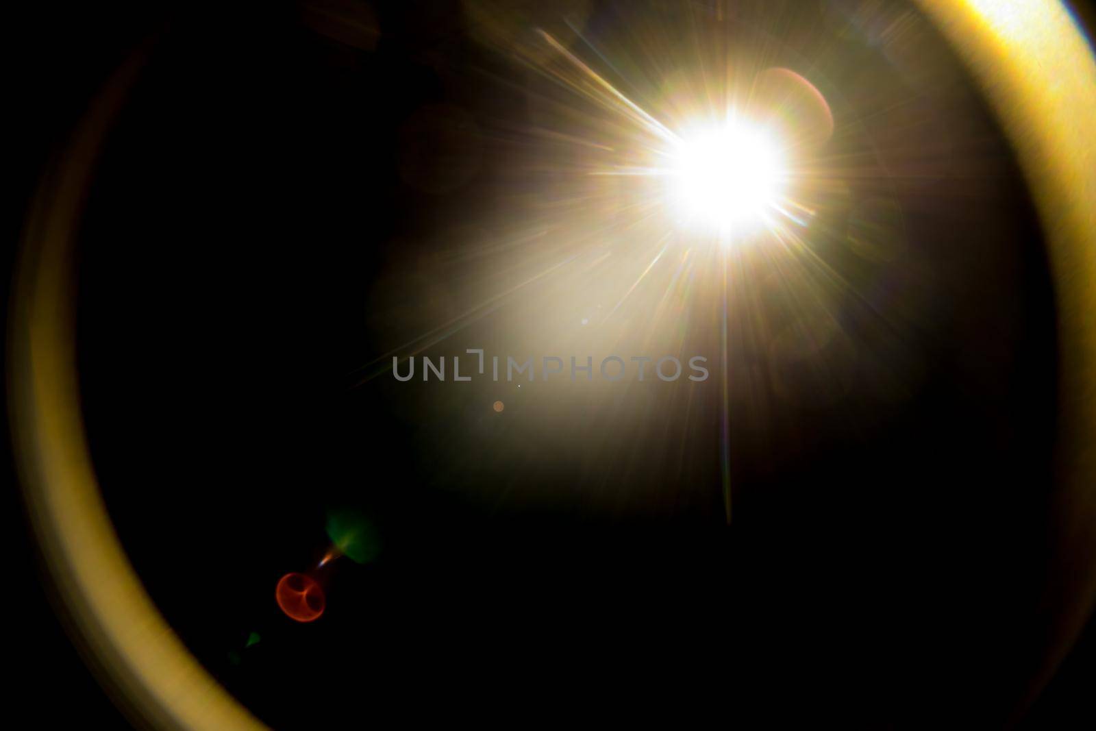 Abstract Natural Sun flare on the black.