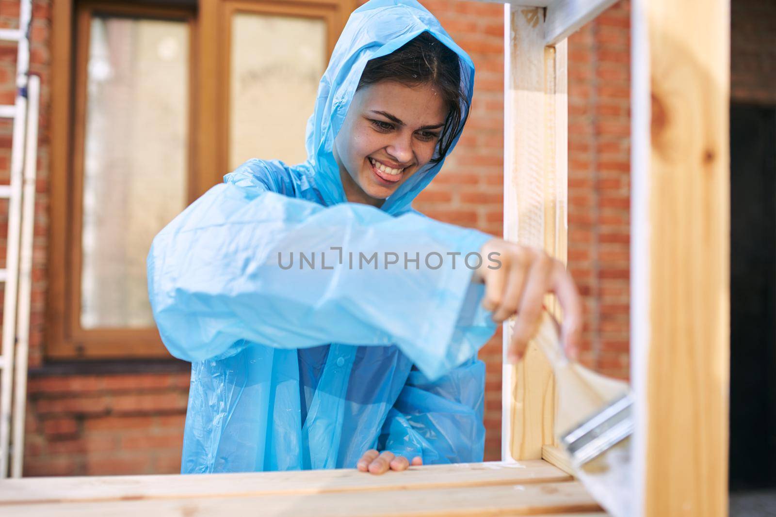 woman paints wood painter repair protective suit by Vichizh