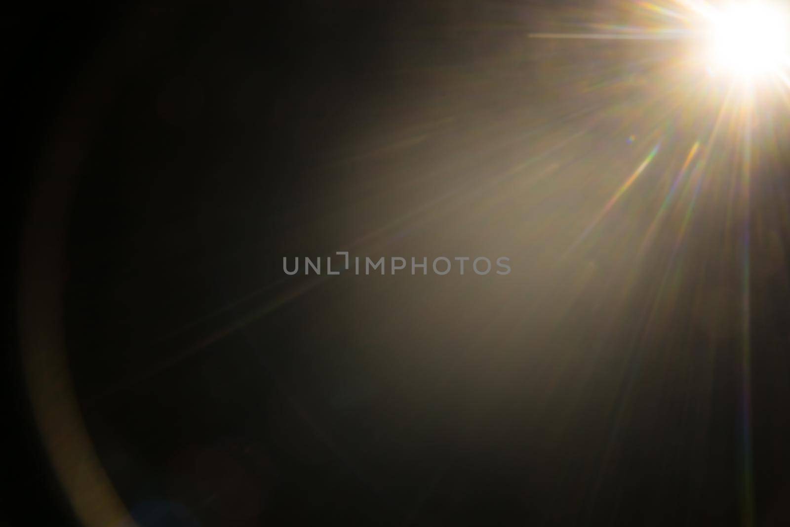 Abstract Natural Sun flare on the black.