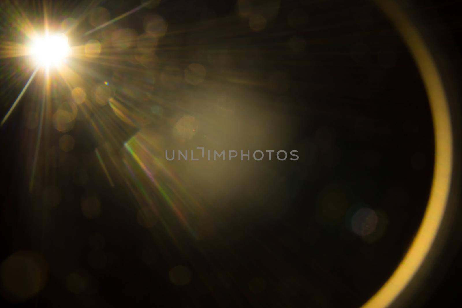 Abstract Natural Sun flare on the black.