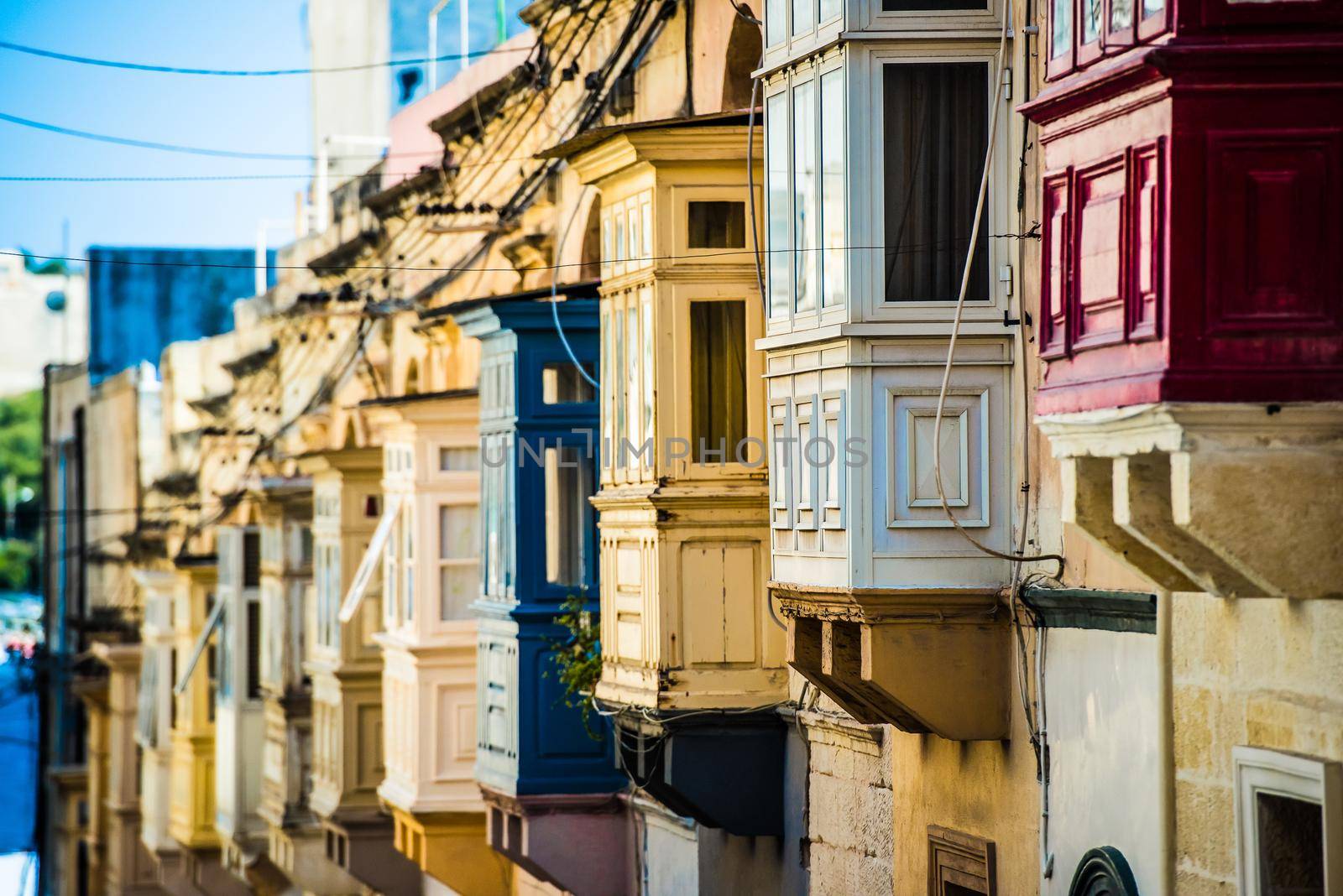 street with traditional balconies in historical center of Valletta in Malta