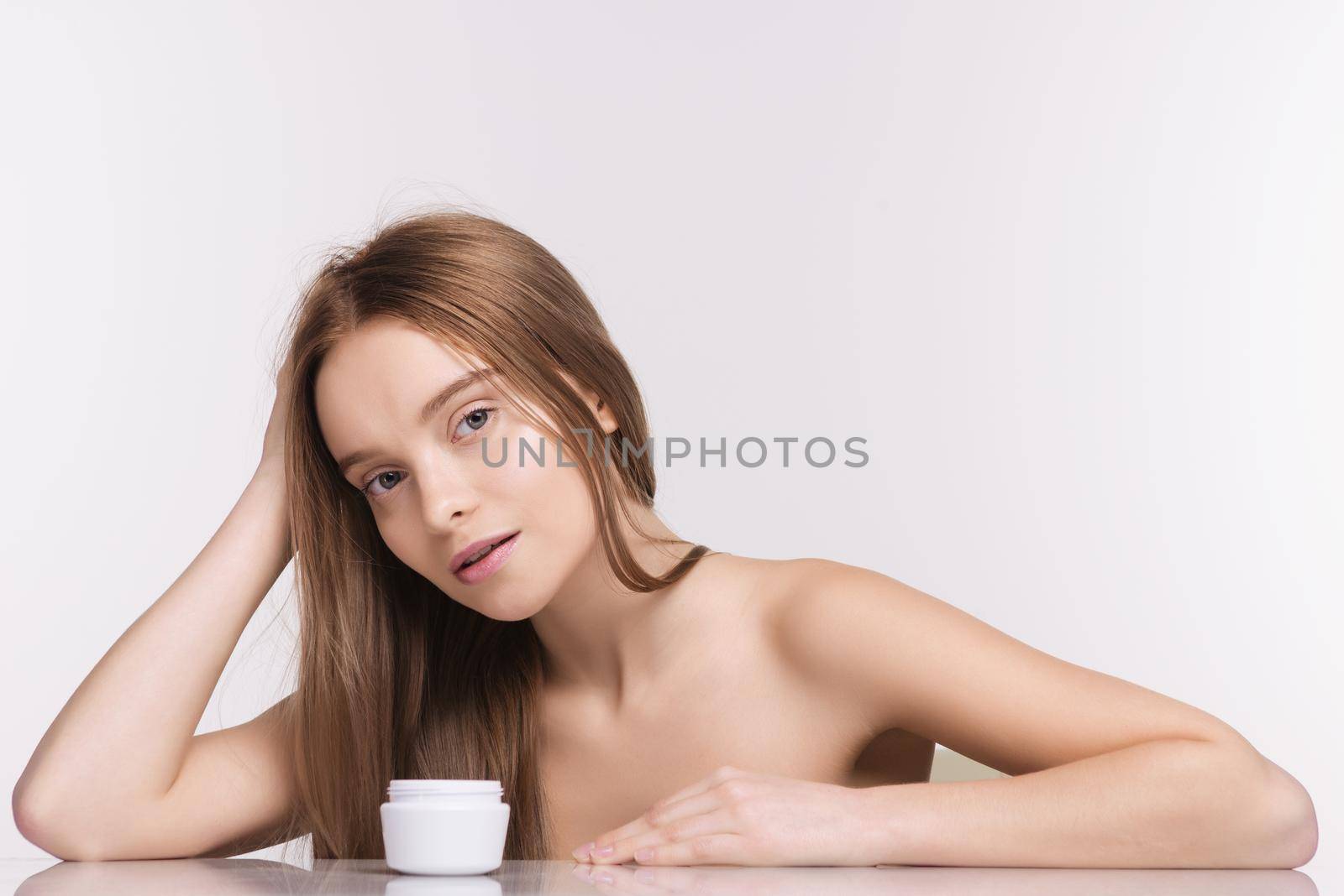 Beautiful spa girl with jar of cream isolated on white background - Image