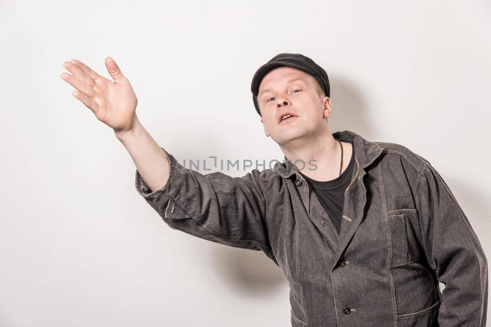 Excited man pointing a great idea adjusting his suspenders