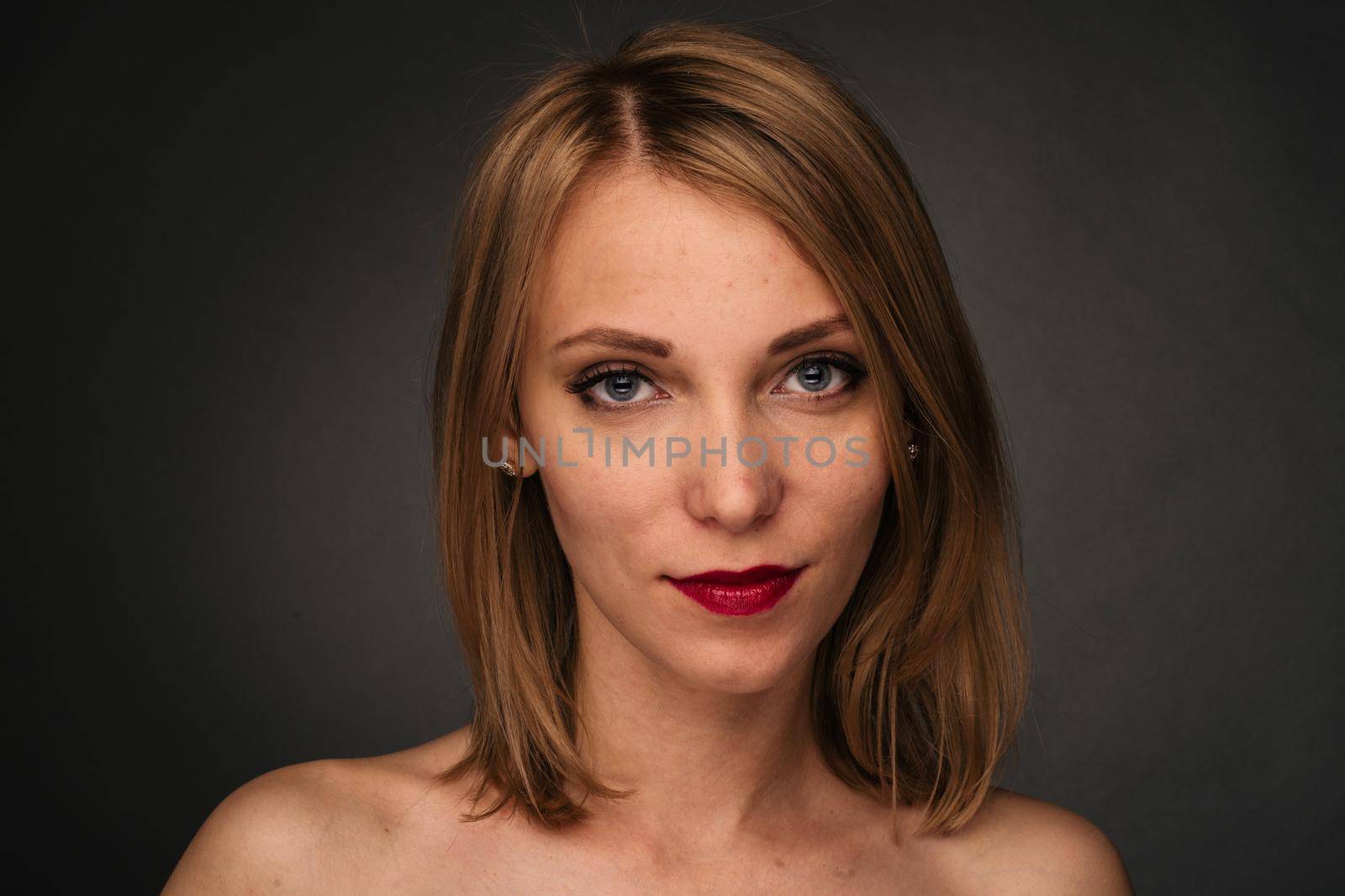 Young girl with acne. Photo of ugly girl with problem skin on dark background. Skin care concept.
