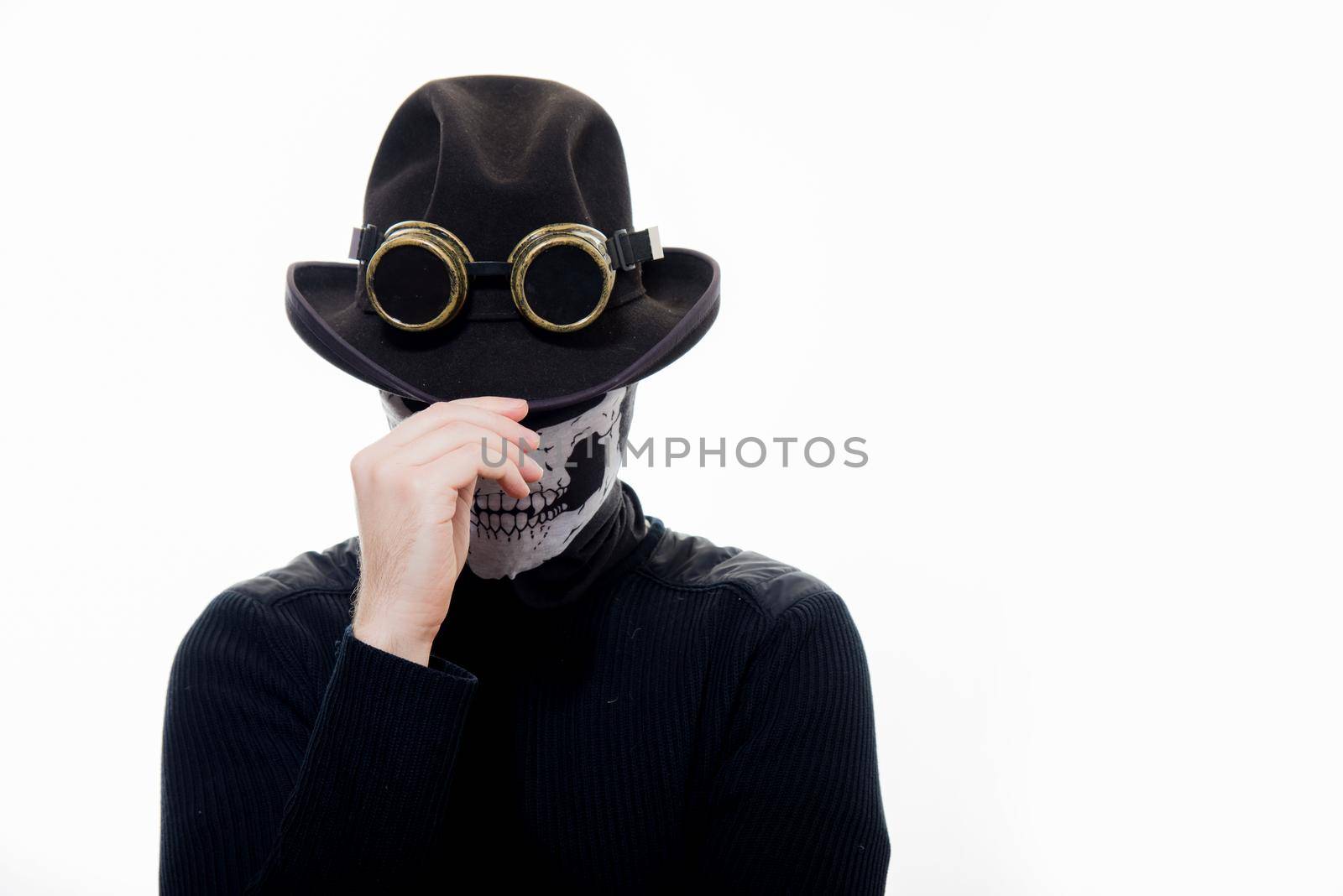 Portrait of a steampunk man in the hat and mask skeleton on white background.